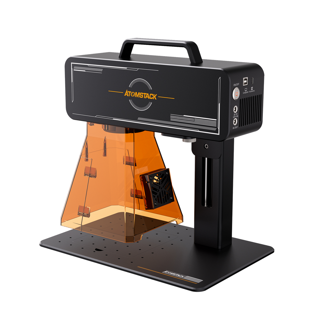 High resolution image showing a side view of the Atomstack M4 Pro laser engraver. The unit has an acrylic shield, exhaust fan and the engraving area and power socket are clearly visible.